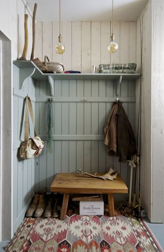 painted shiplap boot room/mudroom with shelving, hooks and bench