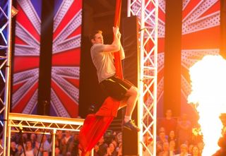 A contestant attempting to climb the rope (Rachel Joseph/ITV)