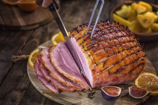 roast ham being sliced