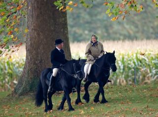 Queen Elizabeth and Terry Pendry riding horses