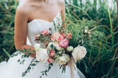 Bride In White Wedding Dress Holding Bridal Bouquet