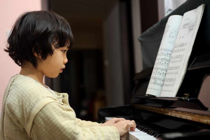 child playing piano