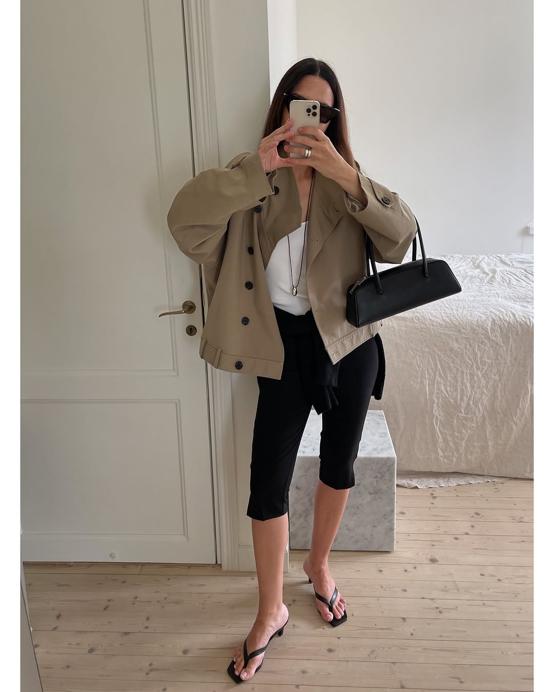 woman wearing black capri pants outfits 2025