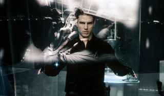 Minority Report Tom Cruise examines futuristic evidence