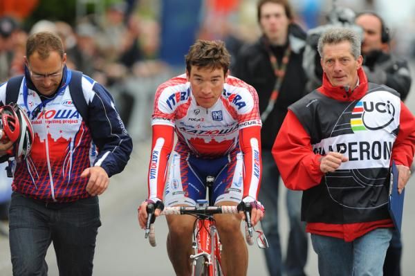 Stage two winner Denis Galimzyanov (Katusha) is escorted to the podium.