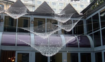 Netting hanging in the air, outside of a building