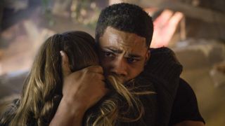 Jordan Calloway as Jake Crawford hugging a woman in Fire Country season 3