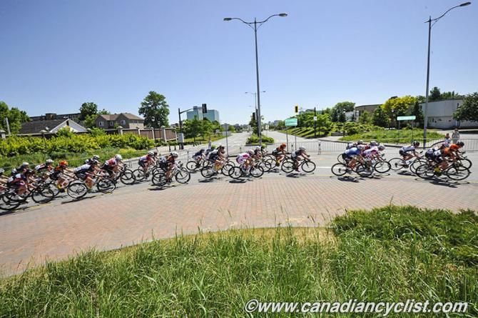 Peloton goes through one of the roundabouts