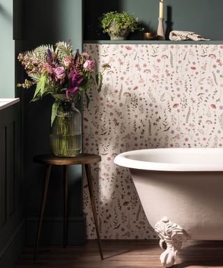 High contrast bathroom with dark green and floral pink wallpaper walls