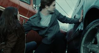 Edward saving Bella from the van