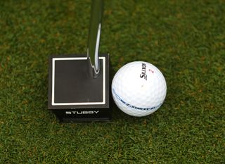 Cleveland putter pictured from above with a ball in front