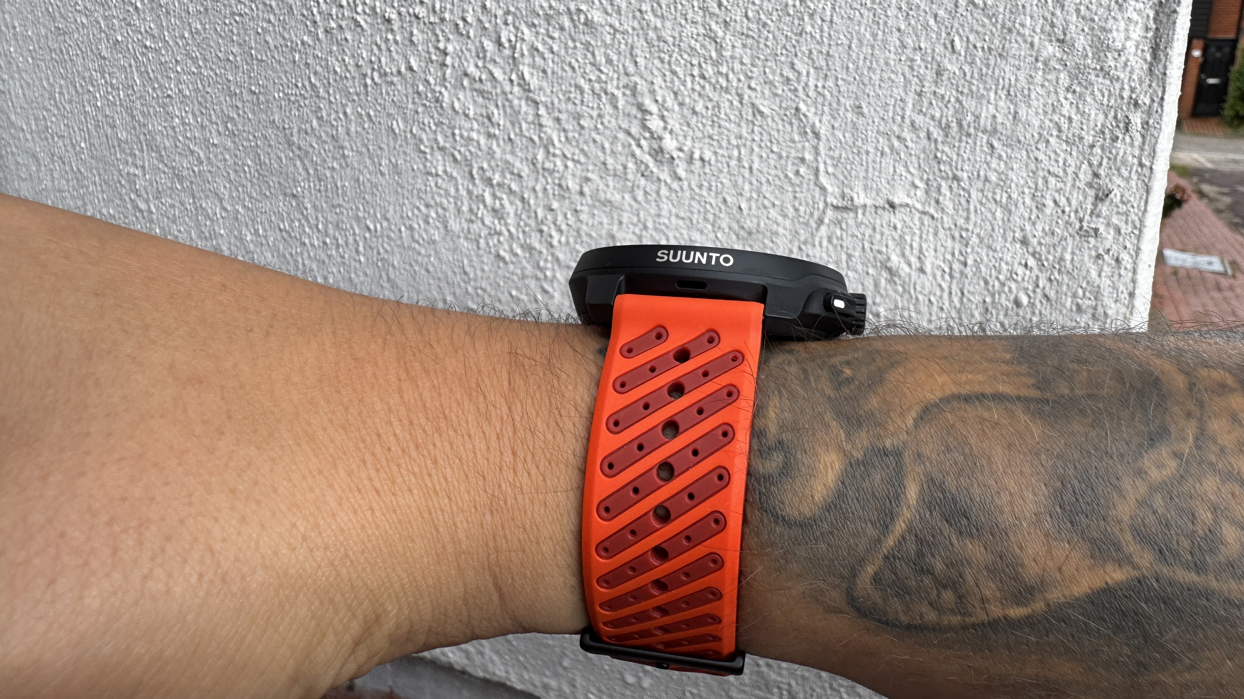 The Suunto Race 2 watch worn on a wrist