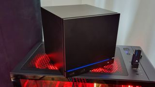A Steam Machine riding on top of a gaming PC