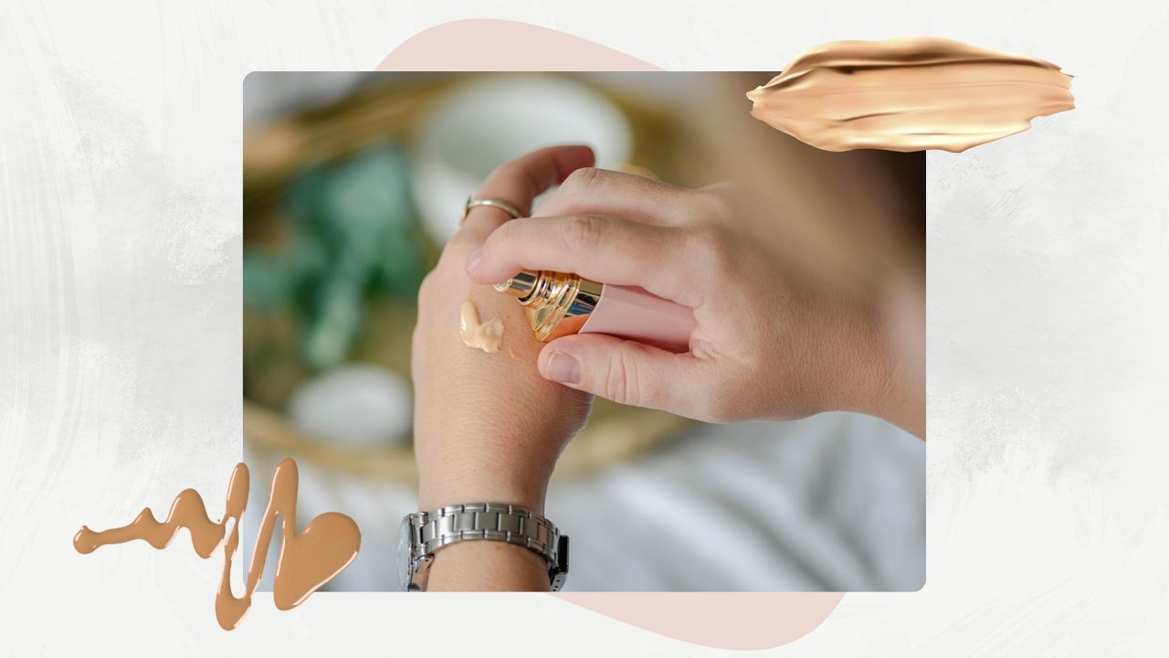 Image of person pumping foundation onto the back of a hand, on a white marble background with pink motif and foundation swatches