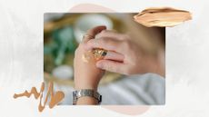 Image of person pumping foundation onto the back of a hand, on a white marble background with pink motif and foundation swatches