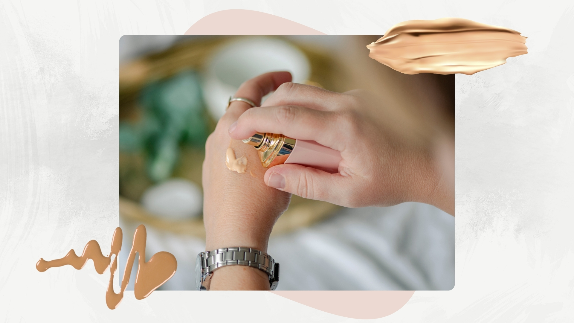 Image of person pumping foundation onto the back of a hand, on a white marble background with pink motif and foundation swatches