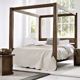 white bedroom with four poster bed