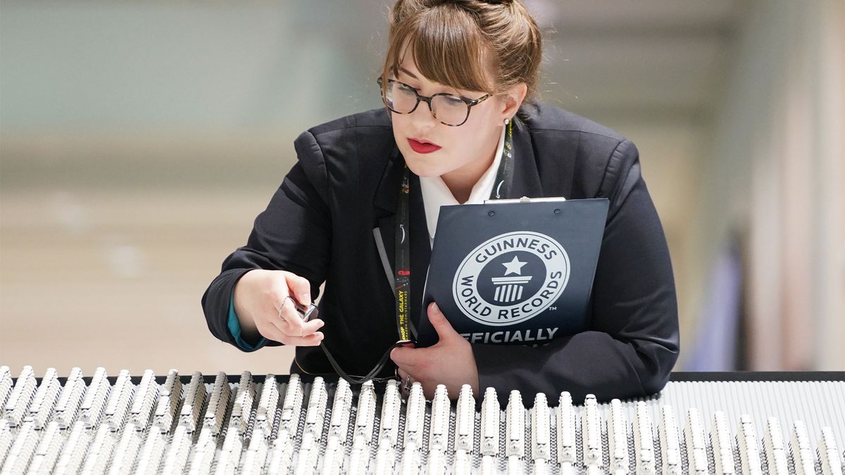 Guinness World Records adjudicator Christina Flounders Colon counts the Stormtroopers.