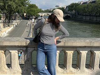 Woman wearing a striped shirt in Paris.