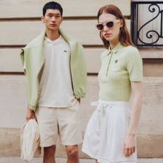 Young woman and man wearing spring Lacoste