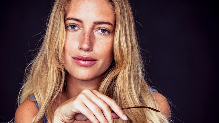 blonde woman with freckles on her face