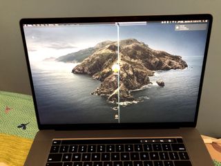 This MacBook cracked screen was apparently the result of a camera cover