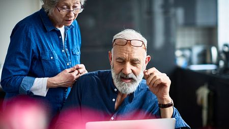 Older couple looking at laptop