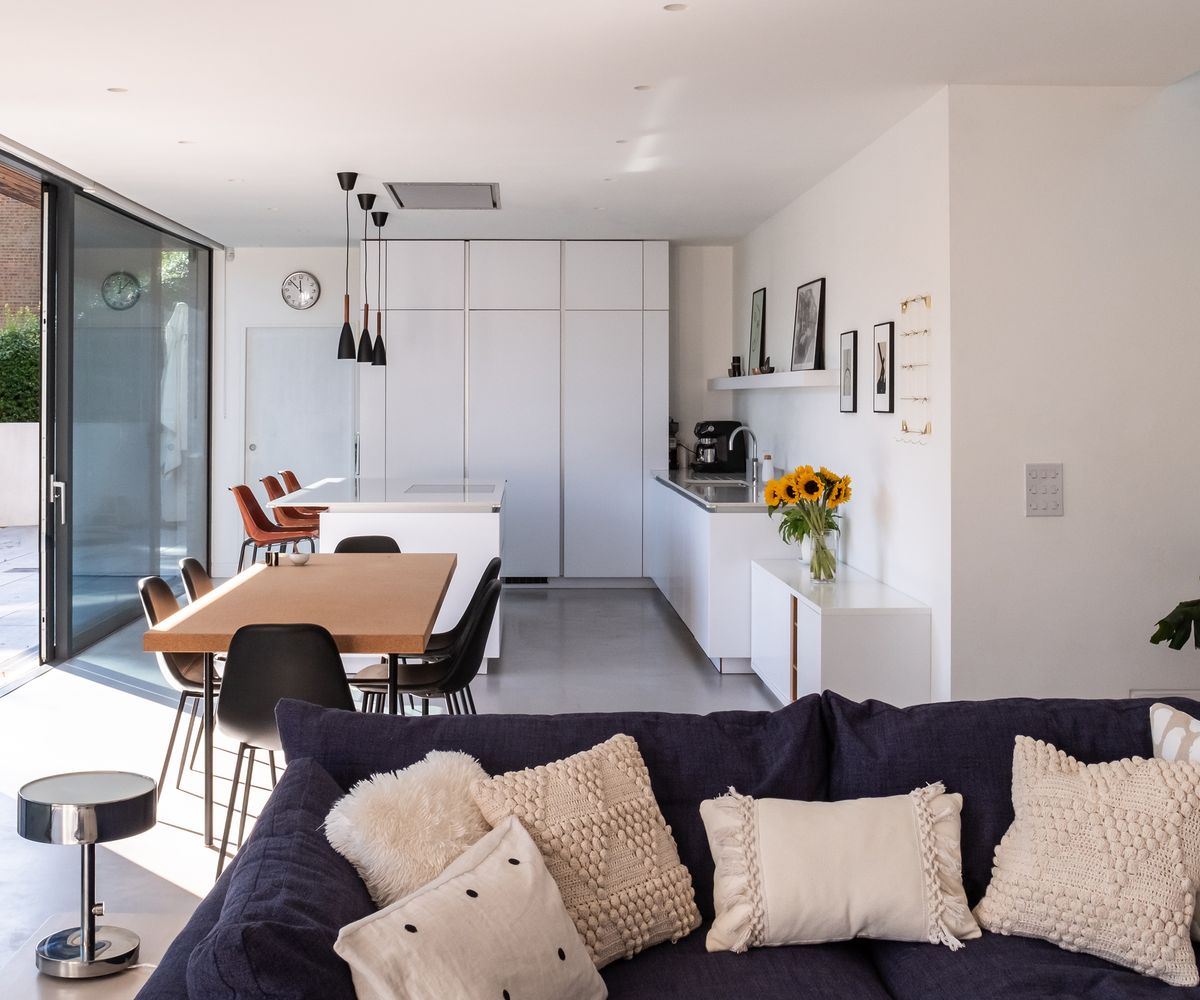View of a large open plan living room, dining room and kitchen in a self build home