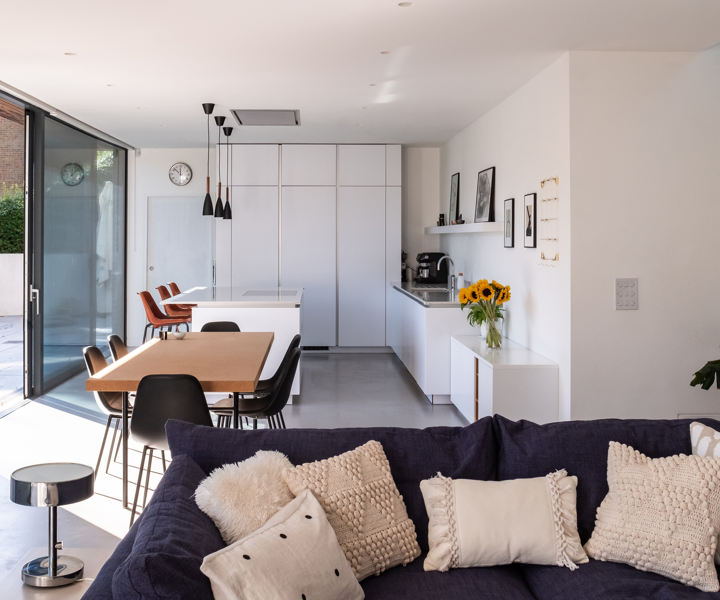 View of a large open plan living room, dining room and kitchen in a self build home