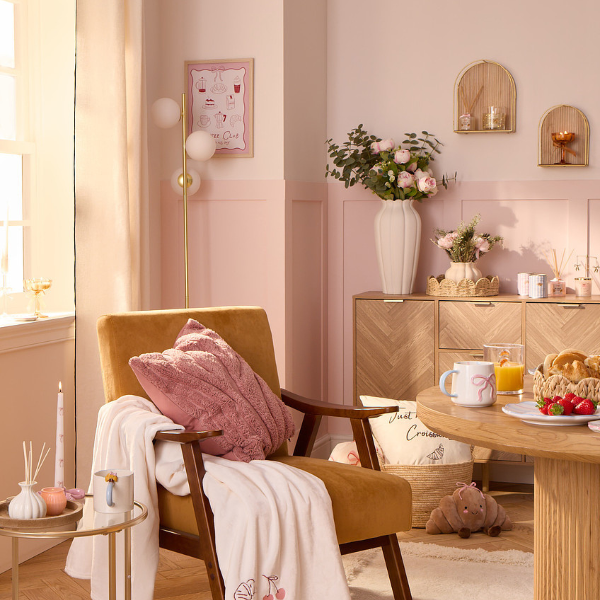 B&amp;amp;M brunch collection. There isa wood table, accent chai and cabinet all displaying cafe-inspired items from the collection.