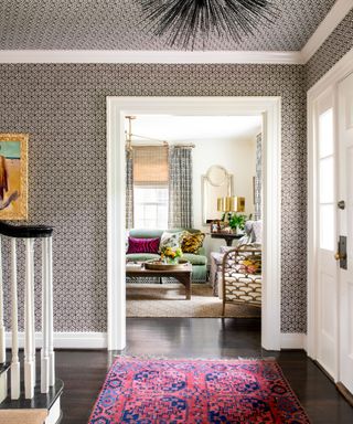 Hallway decorated with a maximalist wallpaper