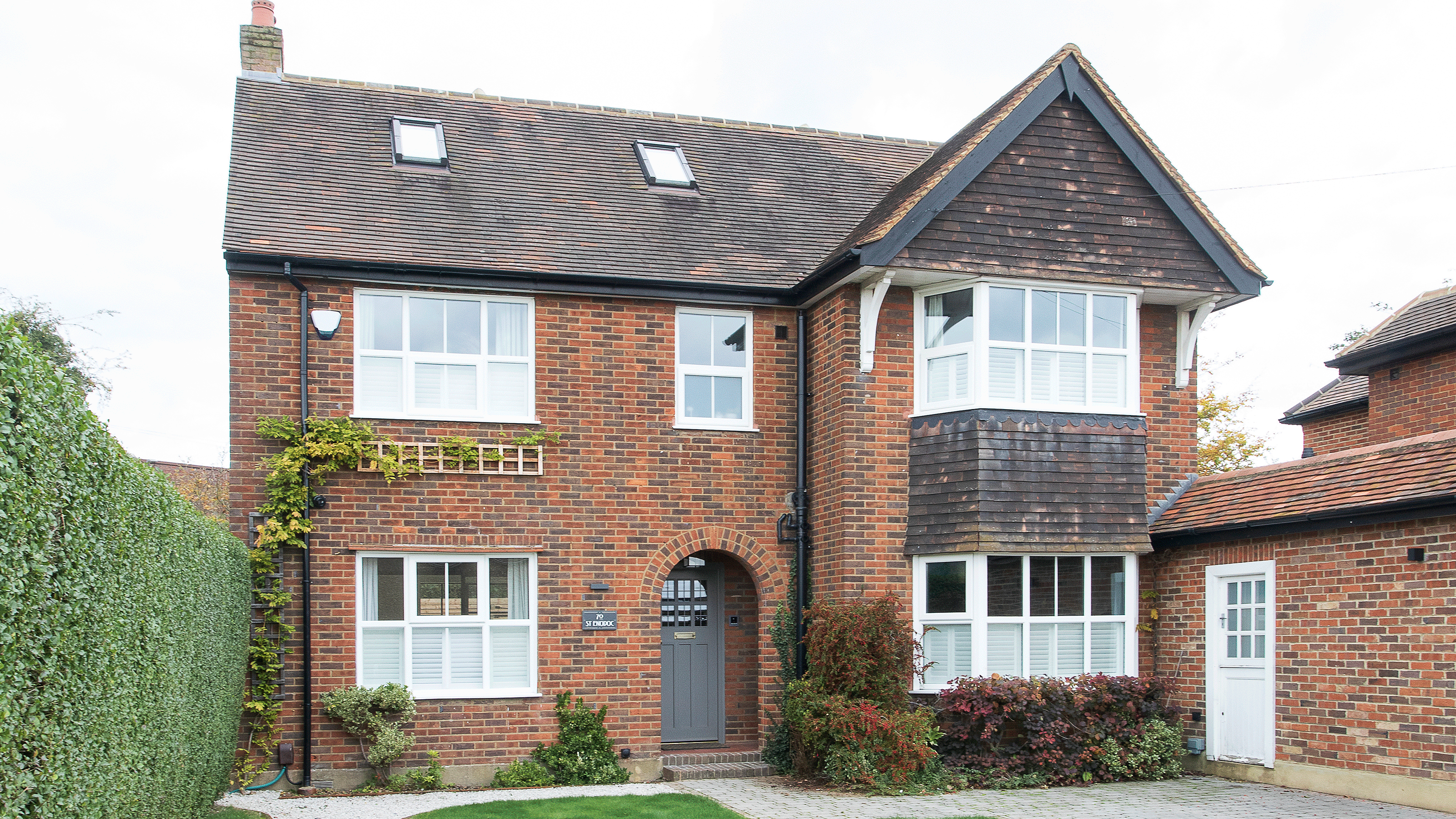 Yellow brick house with blue door