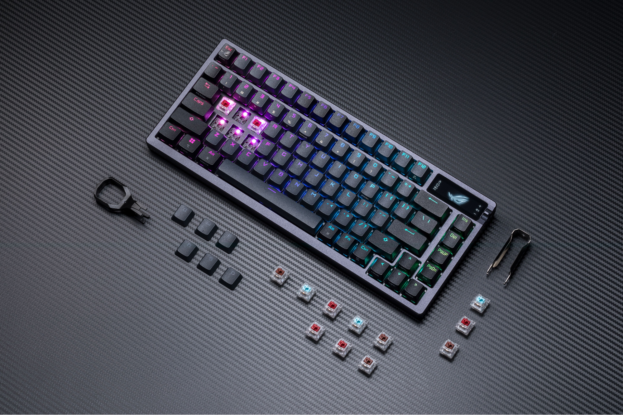 ASUS ROG Azoth wireless keyboard with extra switches and keycaps arranged around the keyboard