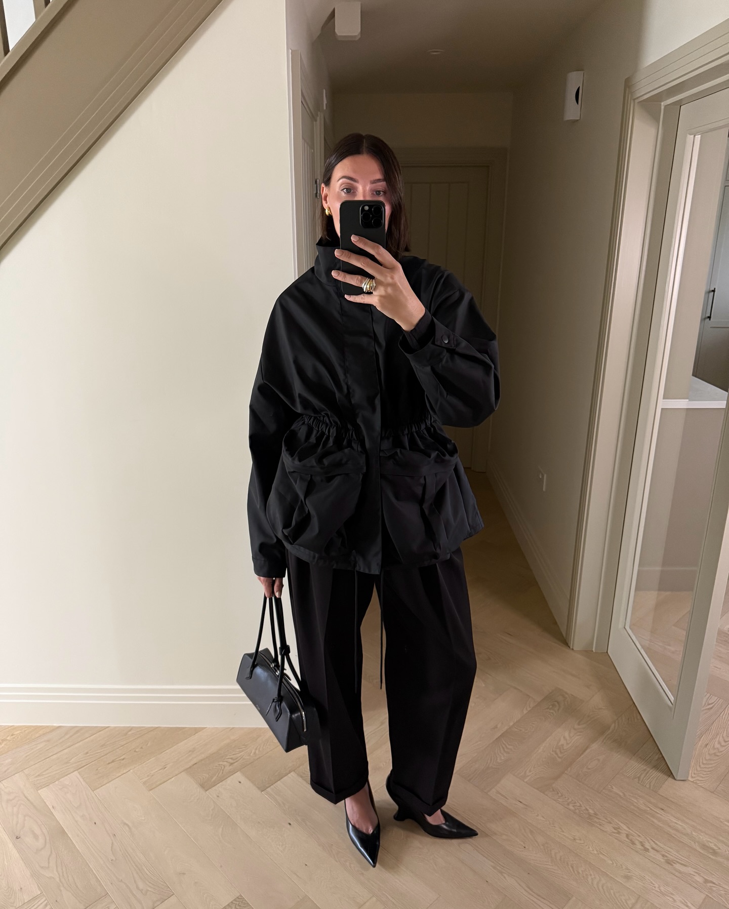 @sarahlouiseblythe wears black barrel trousers
