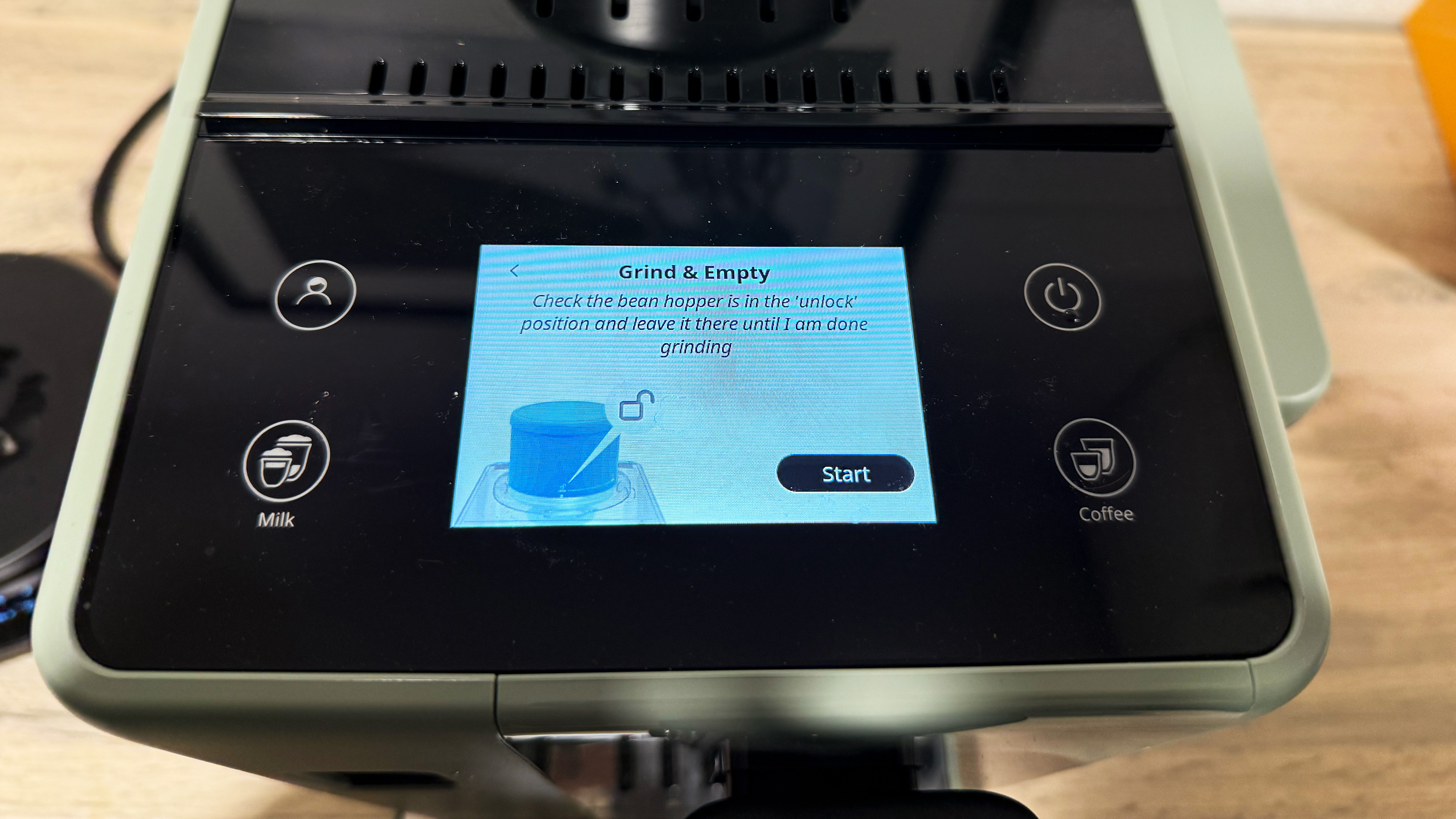 the de'longhi rivelia screen noting that the grinder needs to be unlocked