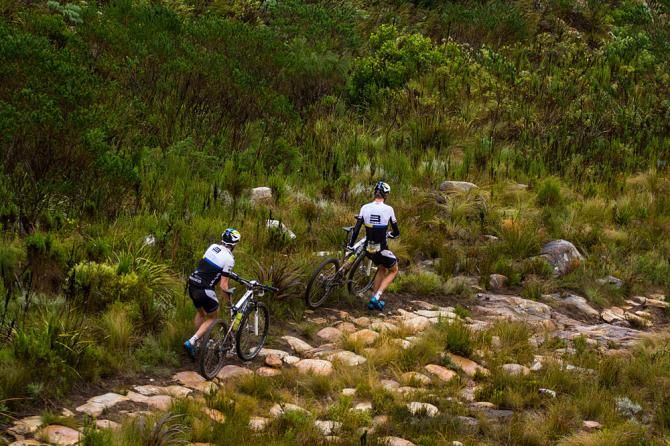 Riders run their machines down a steep descent