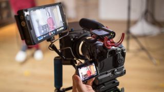 A Canon EOS R5 shooting video with an external recorder