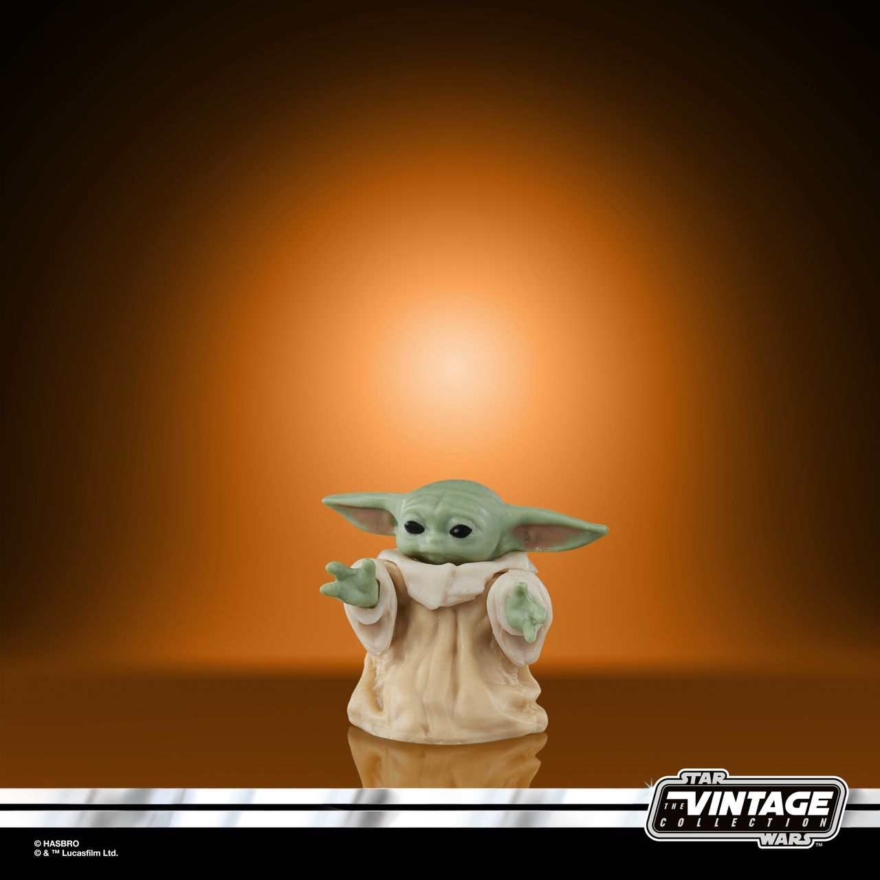 The Vintage Collection Grogu figure on an orange and black background