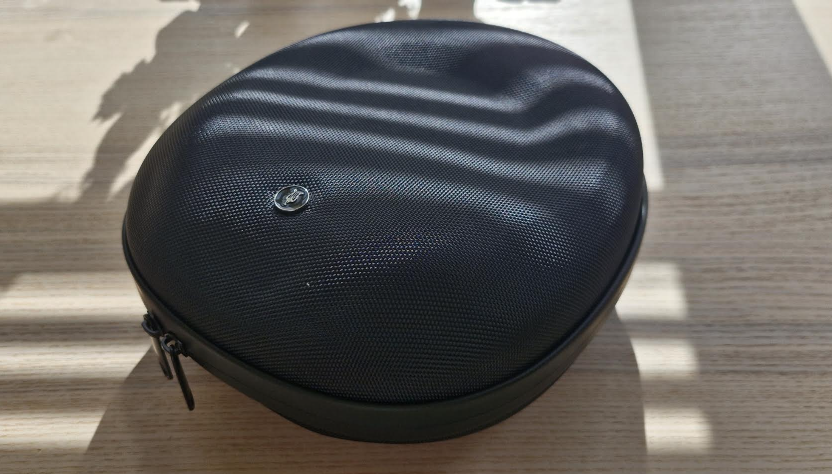 Meze Audio 105 Silva headphones on a light wooden table