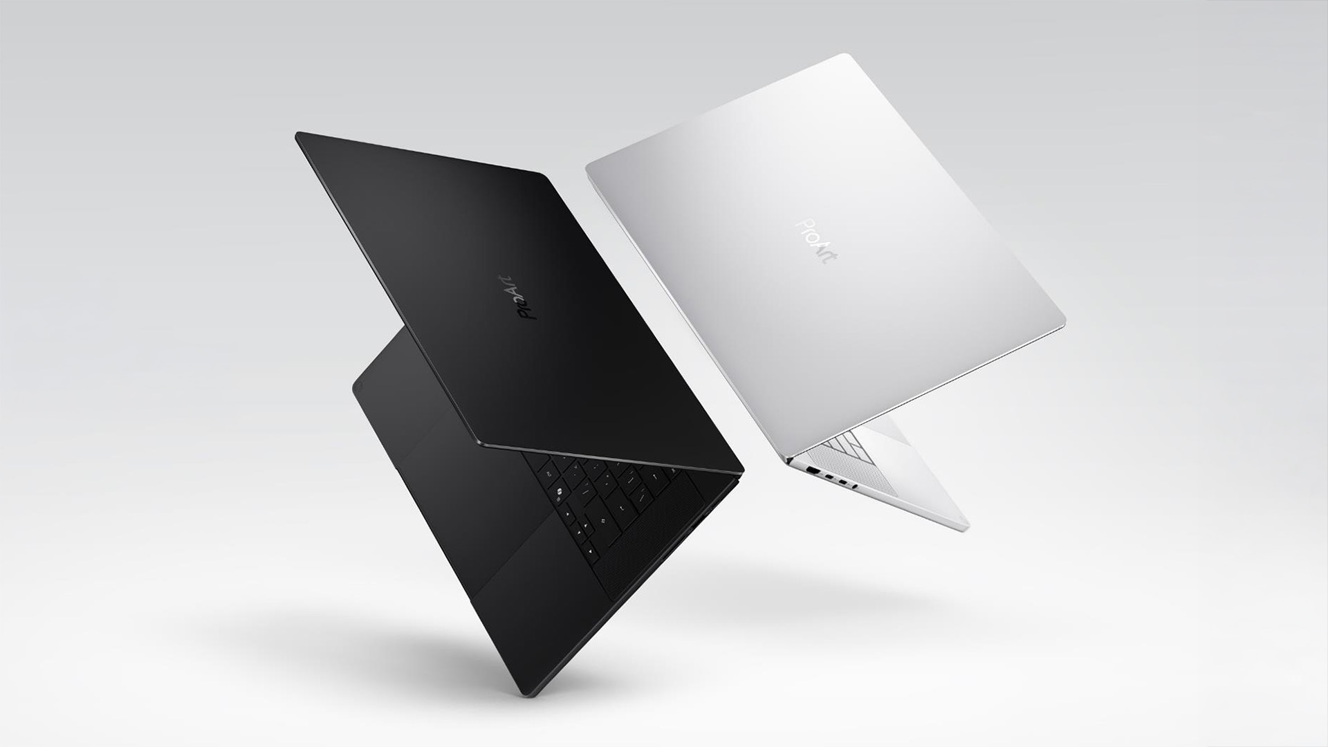 ASUS ProArt 14-inch and 16-inch laptop renders in black and silver floating in space