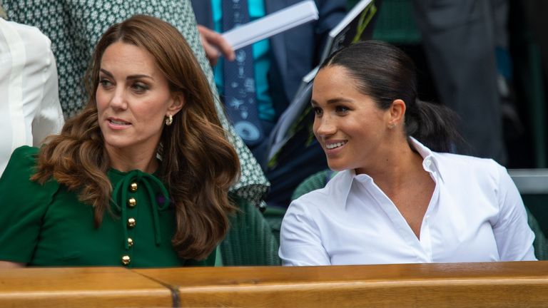  Catherine, Duchess of Cambridge and Meghan, Duchess of Sussex in the Centre Court Royal Box before the Ladies Singles Final between Simona Halep of Romania and Serena Williams of USA on Day Twelve of The Championships - Wimbledon 2019 at All England Lawn Tennis and Croquet Club on July 13, 2019 in London, England. 