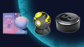 Three projectors, one purple, one black and yellow and one black are lined up side-by-side in front of a blue planet background.