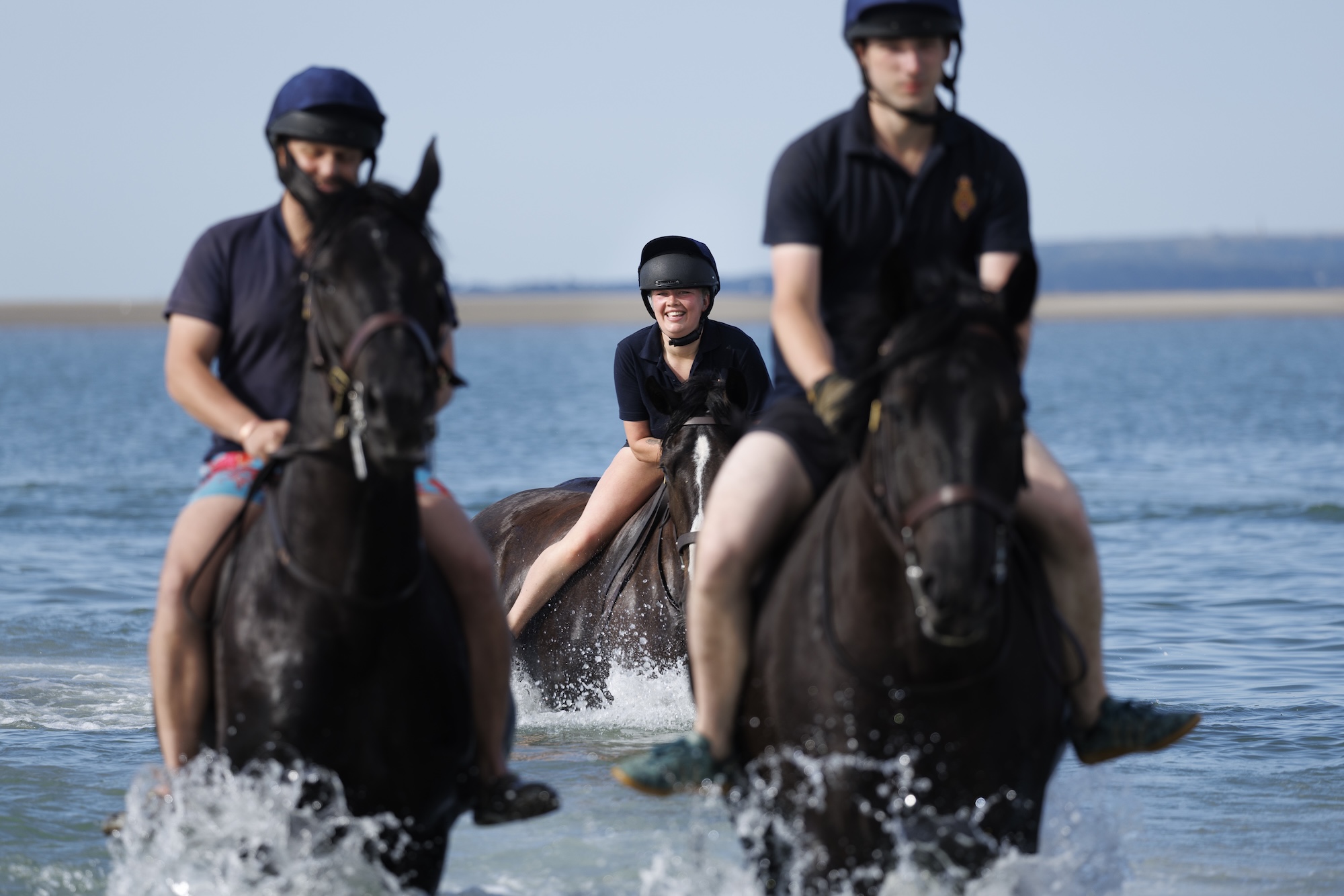Pictured: Soldiers and horses from the Household Cavalry Mounted Regiment at Hayling Island beach on Friday 3 July 2026. The Household Cavalry Mounted Regiment swap the streets of London for the shores of Hampshire. As part of their three-week Summer Camp, The Life Guards and Blues and Royals deployed their Military Working Horses to Hayling Island Beach for a day of equine training with a difference. After welcoming four world leaders to Windsor, protecting The King at the State Opening of Parliament, and a spectacular King's Birthday Parade, a day in the sea felt very well-deserved. These horses face the noise and chaos of London every single day &amp;mdash; sirens, crowds, and all the unexpected delights of city life, so building their confidence through exposure to new environments is essential. The beach &amp;mdash; with its shifting sands, crashing waves, screeching gulls, and overexcited children &amp;mdash; is the perfect testing ground. For the youngest horses, it was their very first encounter with the sea. Watching