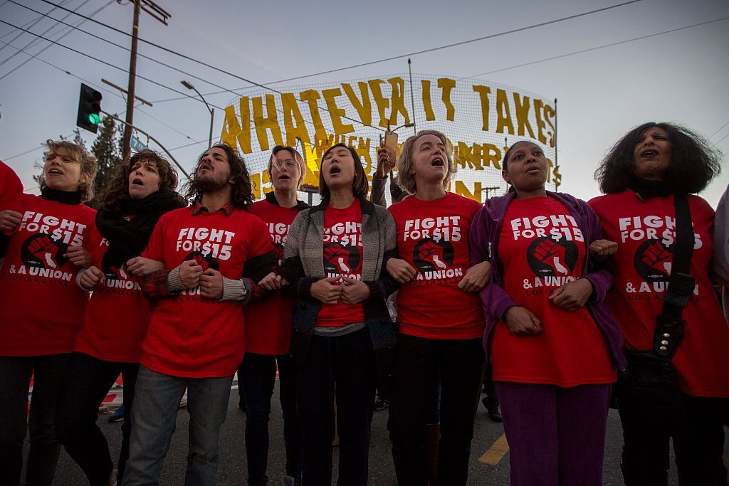 Workers protest for $15 minimum wage.