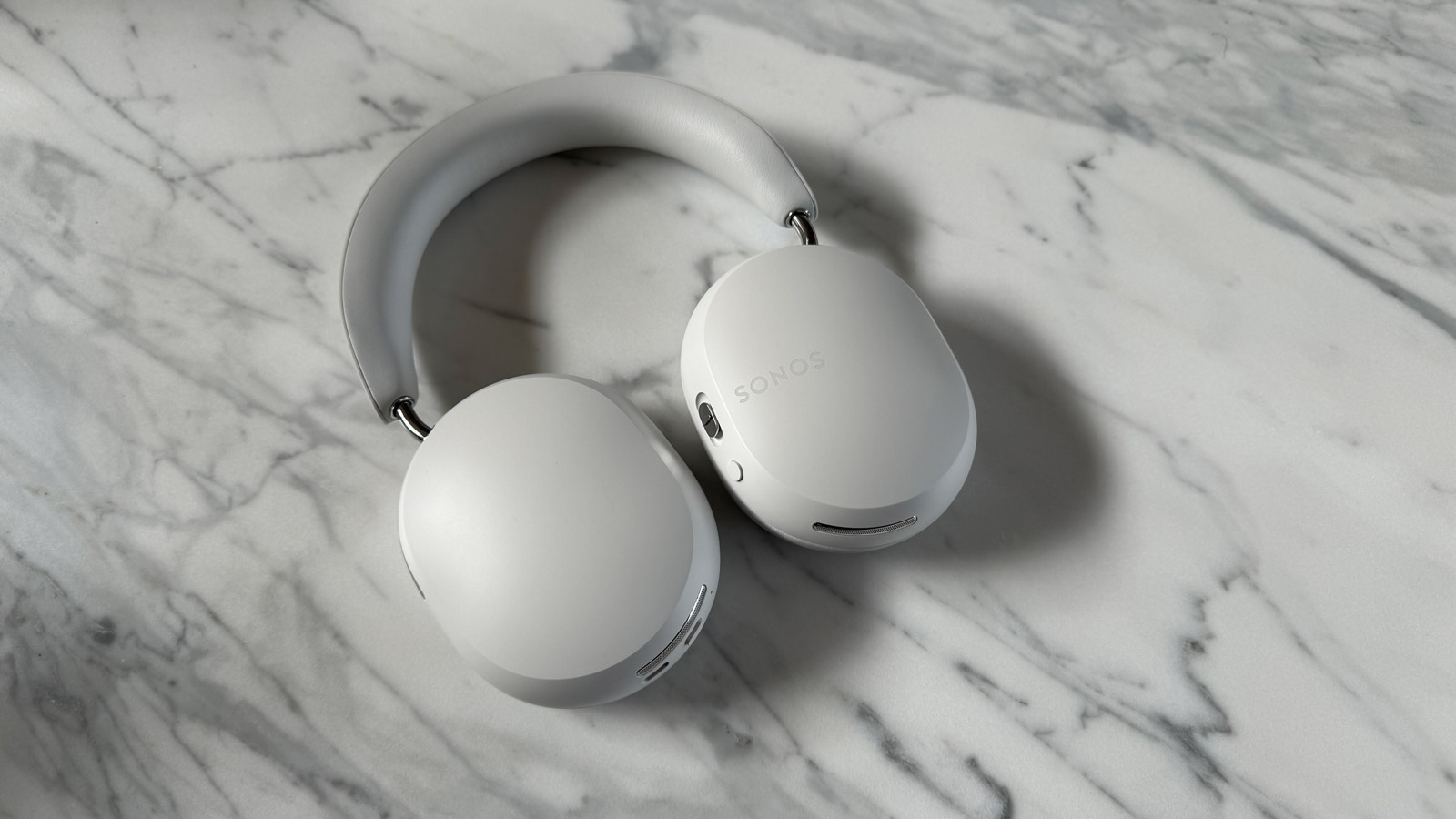 Sonos Ace headphones in soft white being oldschool on head