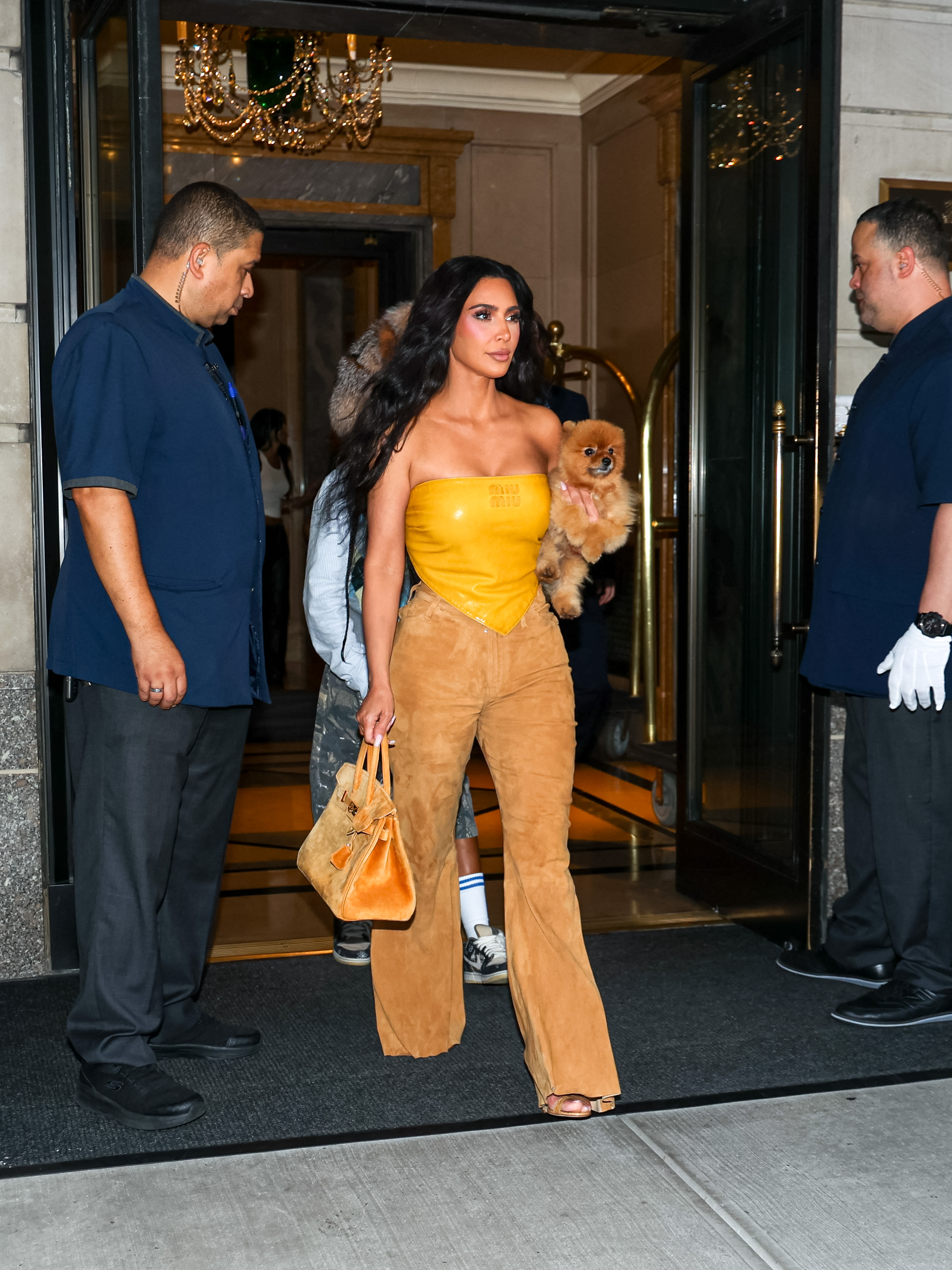 Kim Kardashian wears the same leather bandana as Gigi Hadid in Paris.