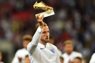England's striker Harry Kane is presented with his Golden Boot award for being the top goal-scorer at the 2018 World Cup in Russia ahead of the UEFA Nations League football match between England and Spain at Wembley Stadium in London on September 8, 2018.