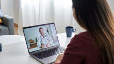 Somebody having a video appointment with a doctor