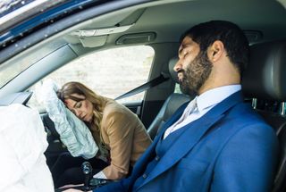 Toyah and Imran lie unconscious in the car