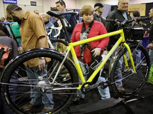 This gleaming yellow titanium hardtail was shown off with studded tires and chrome fenders.